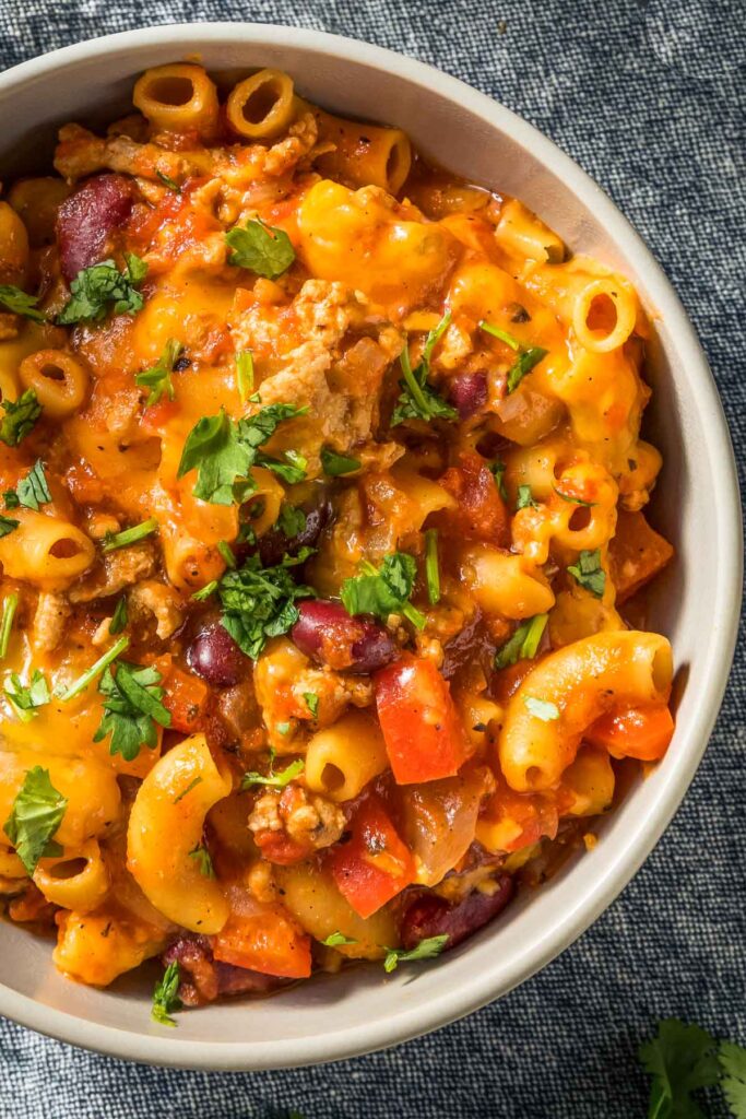 a closeup of a bowl of instant pot chili mac and cheese